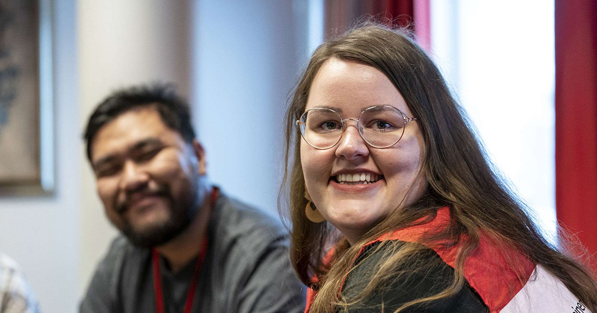 Two Red Cross volunteers smile towards the camera.