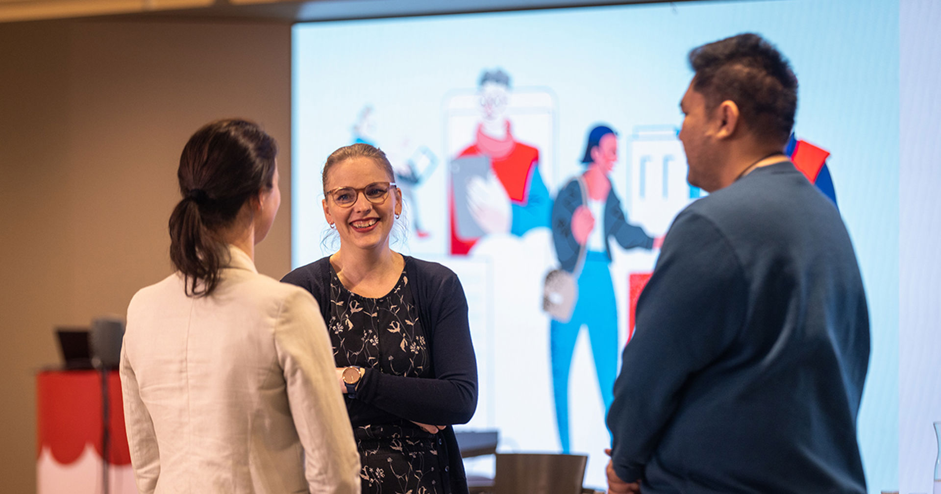 Three people having a conversation.