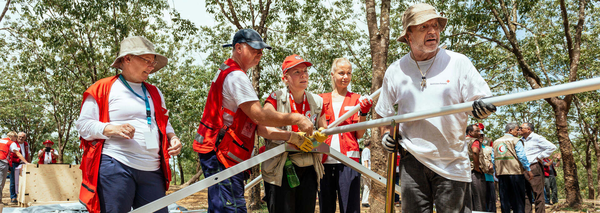 People building a field hospital together.