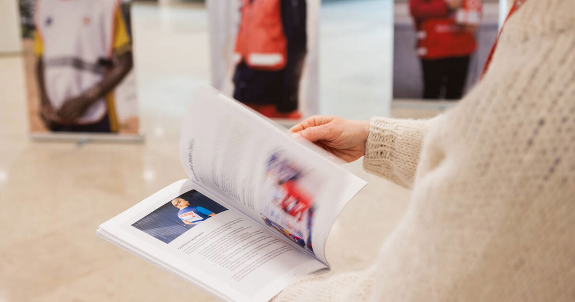 Hands swiping through a leaflet.