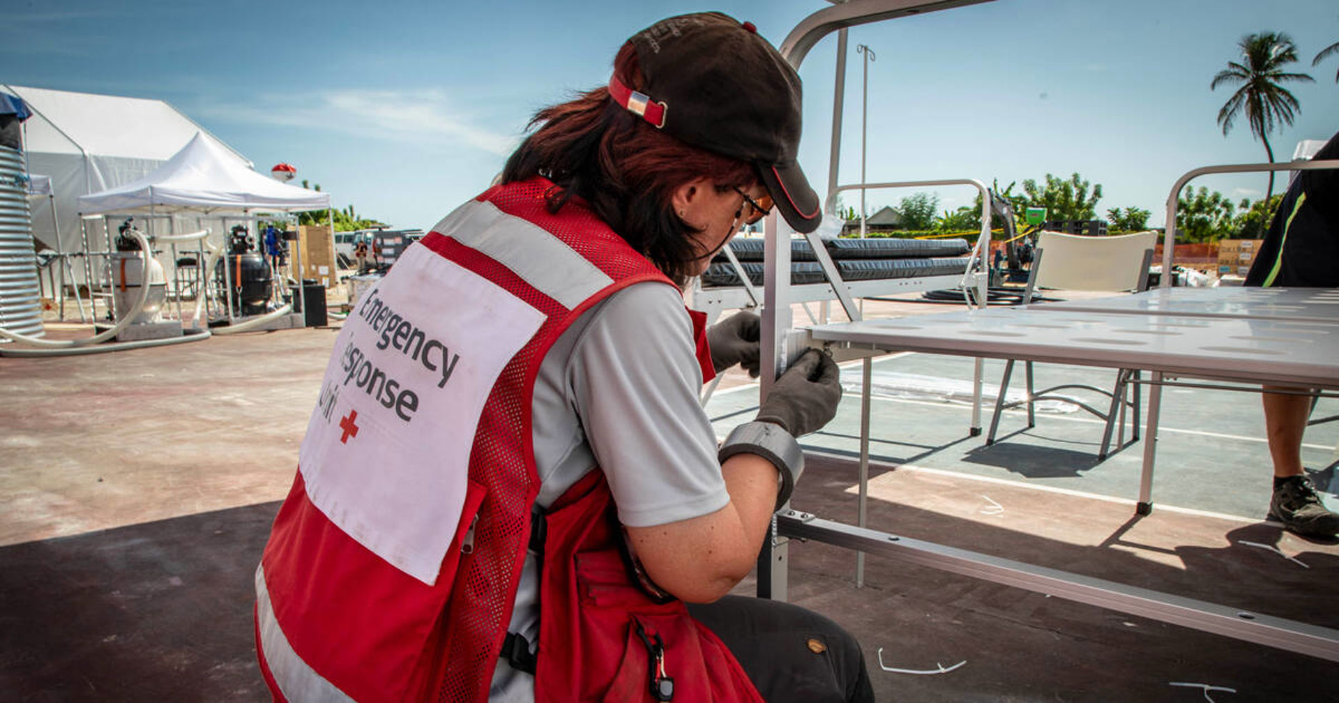A delegate of Redcross building something.