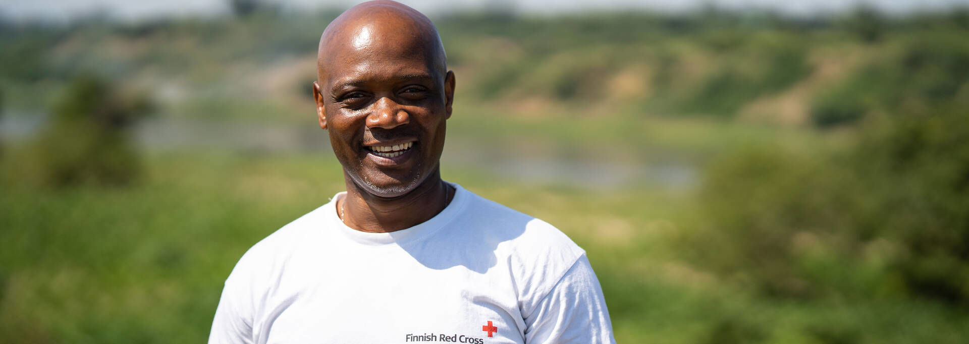 Finnish Red Cross delegate smiling at the camera.