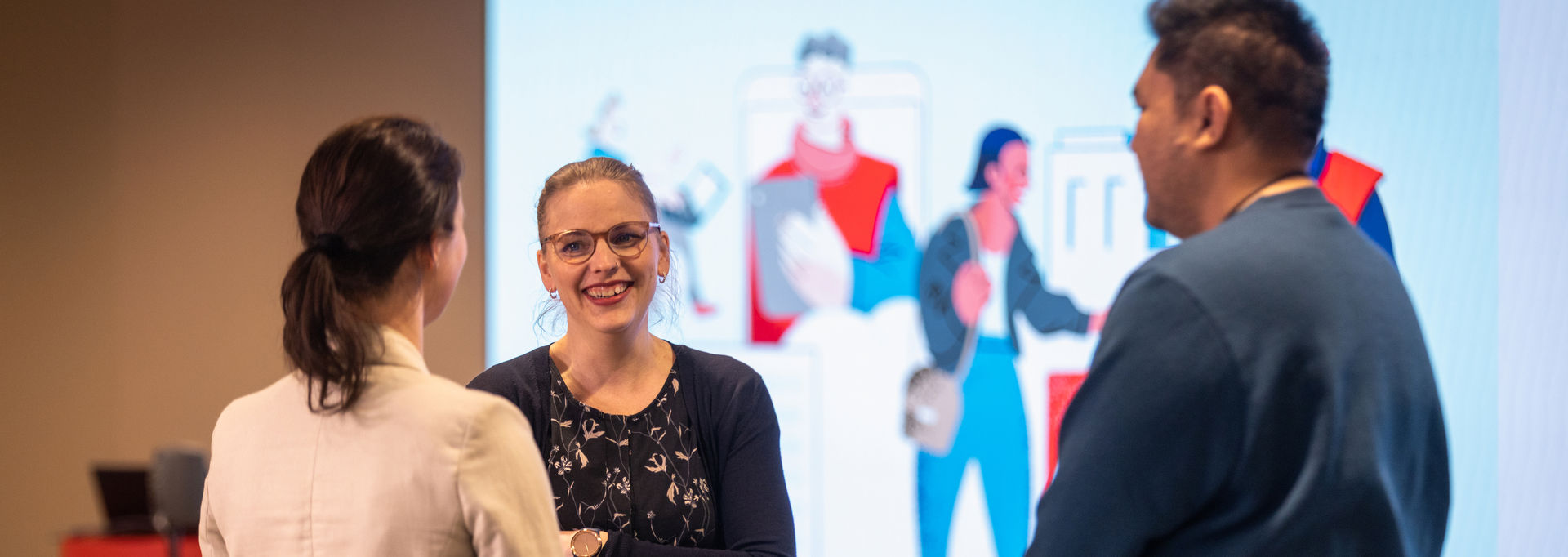 Three people are chatting.