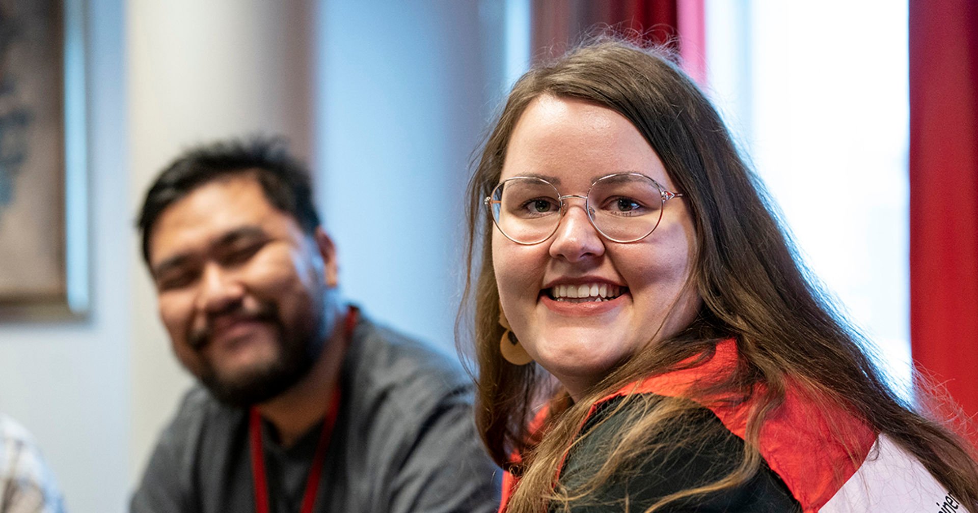 Two Red Cross volunteers smile towards the camera.