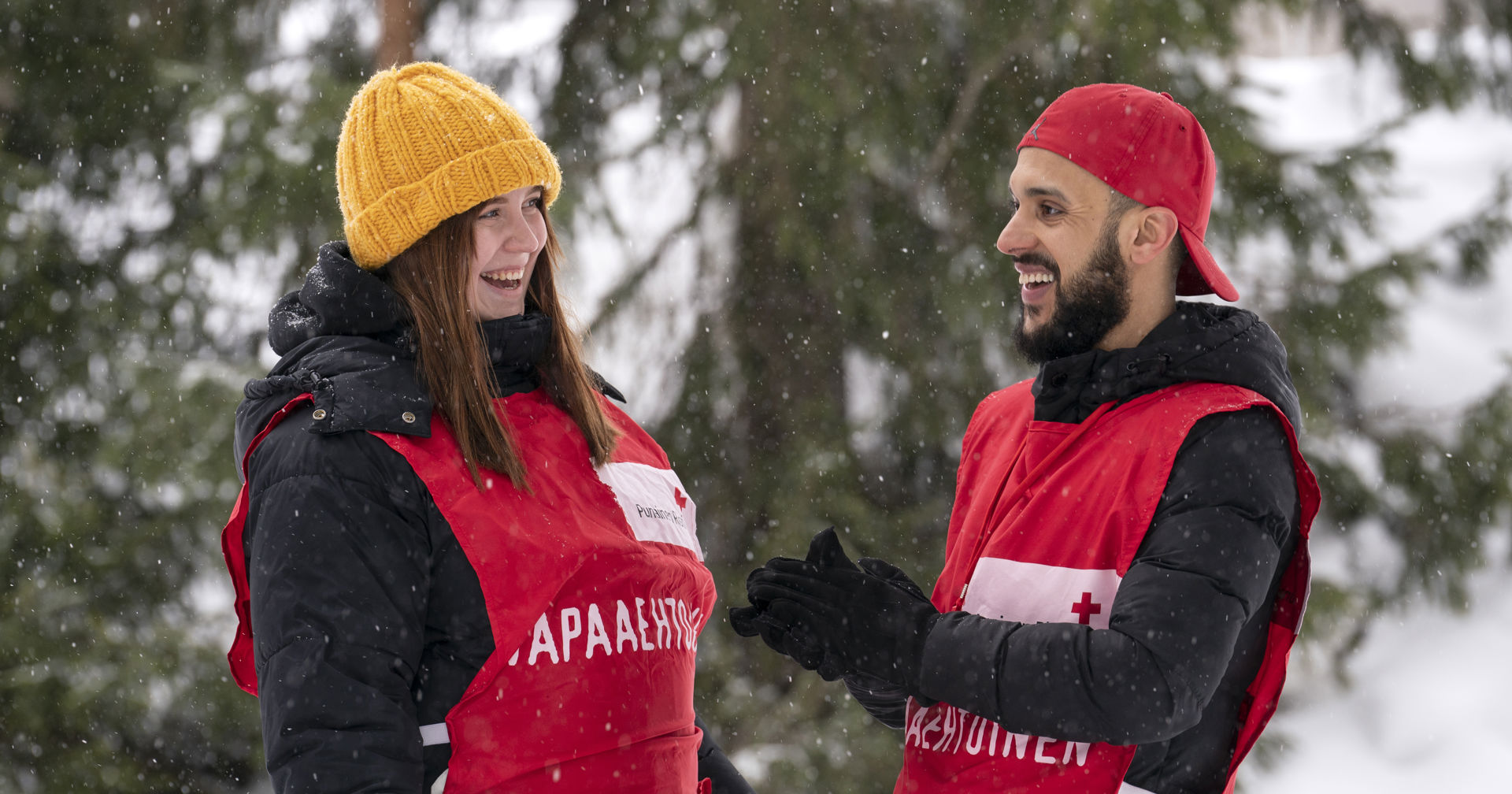 Volunteers smiling at each other.