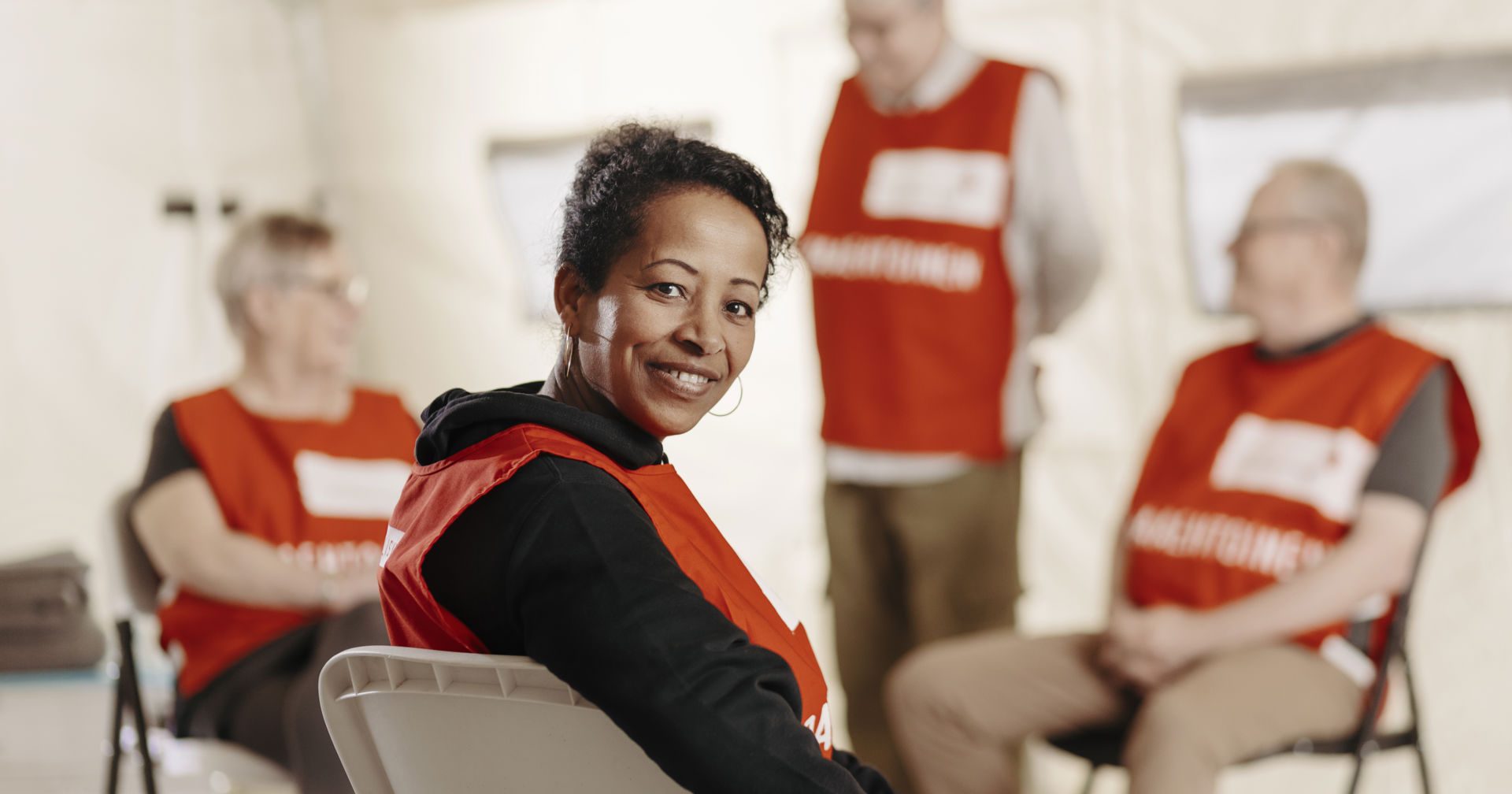 A smiling volunteer looking at the camera.