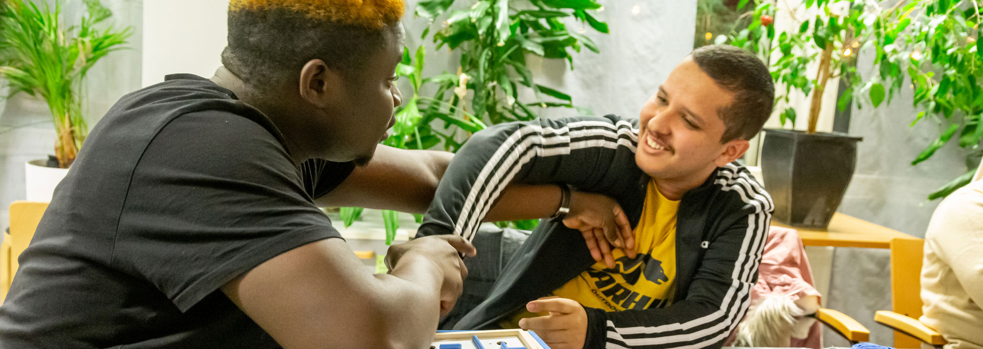 Two people playing a board game.