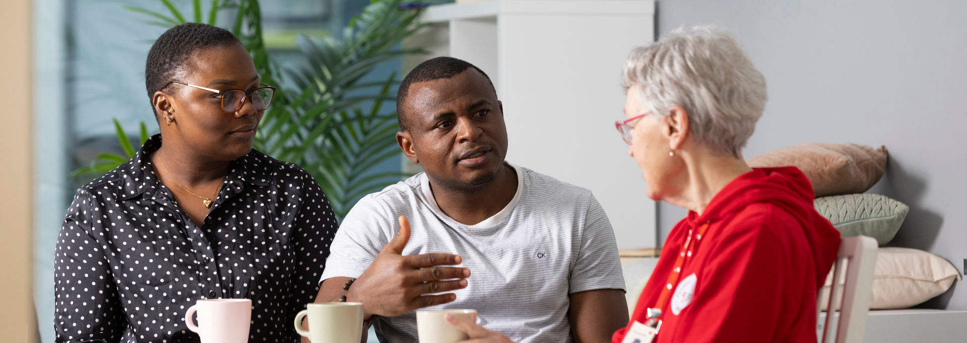 Three people talking together.