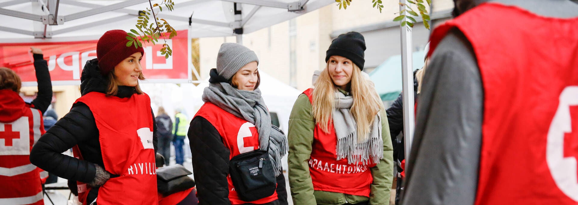 Red Cross volunteers at a food aid event.
