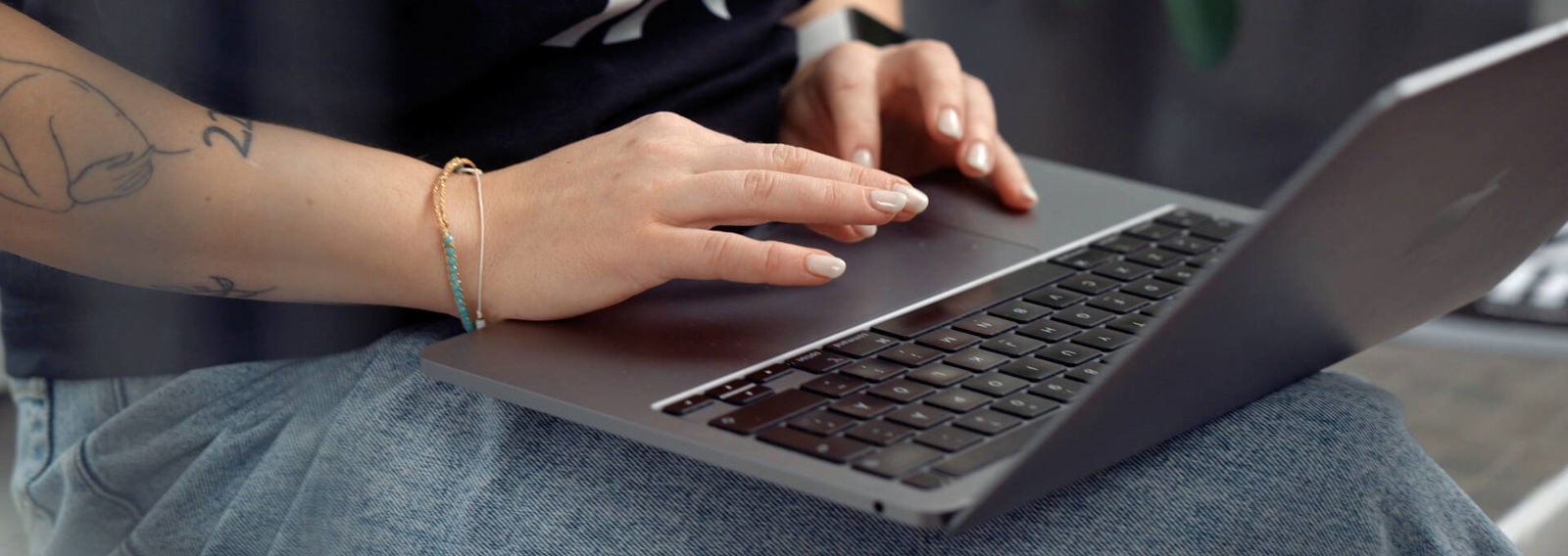 Hands on a computer keyboard.